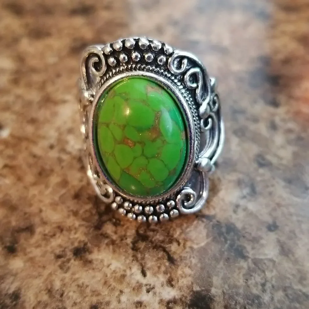 Inlaid turquoise egg shape carved ring size 8